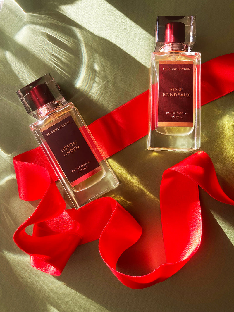 A natural linden perfume and and natural rose perfume with red ribbon